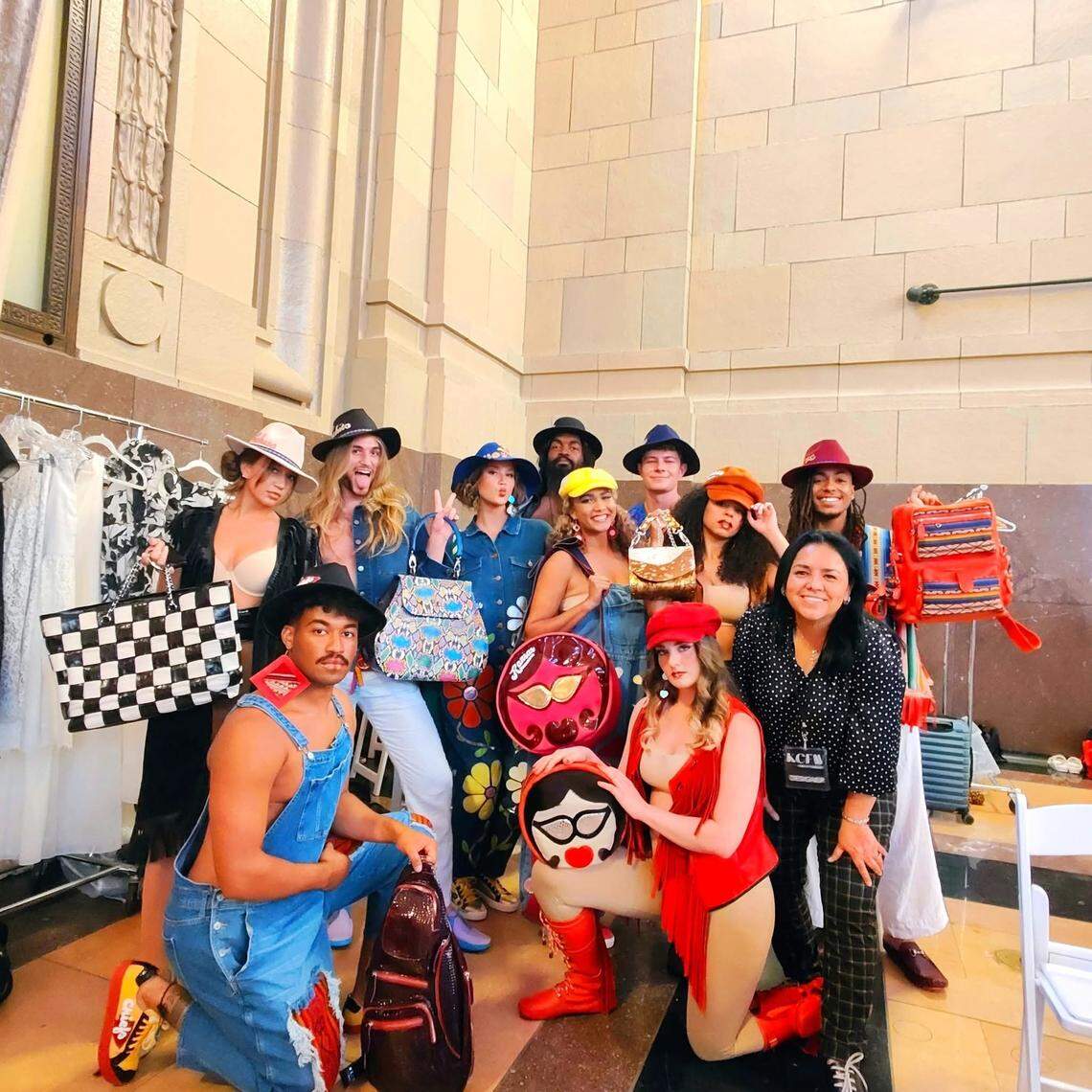 Wichita designer Aida Stenholm, at right in black shirt, with the models for her Kansas City Fashion Week show.