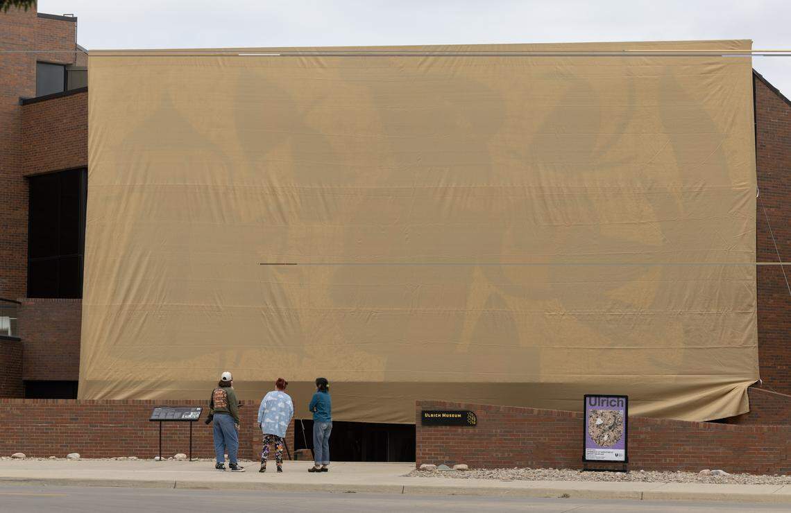 Wichita State’s Ulrich Museum of Art put a covering over Joan Miró's glass mosaic “Personnages Oiseaux” on Tuesday as part of an “Adopt-A-Sculpture” fundraiser. The artwork will be unveiled on Wednesday.