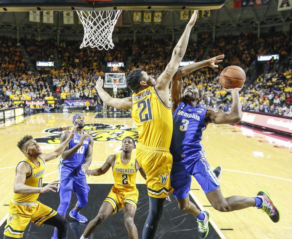 Memphis guard Jeremiah Martin drives to the basket against Wichita State forward Jaime Echenique during the first half of their game at Koch Arena on Saturday.