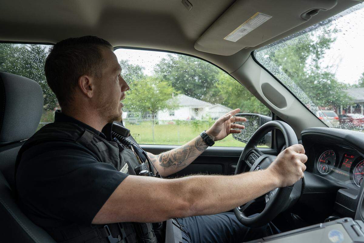 Wichita police officer Blake McElwain drives around the Hilltop neighborhood, one hot zone for gun crimes, according to software the city is using to focus on, and reduce, gun crimes.