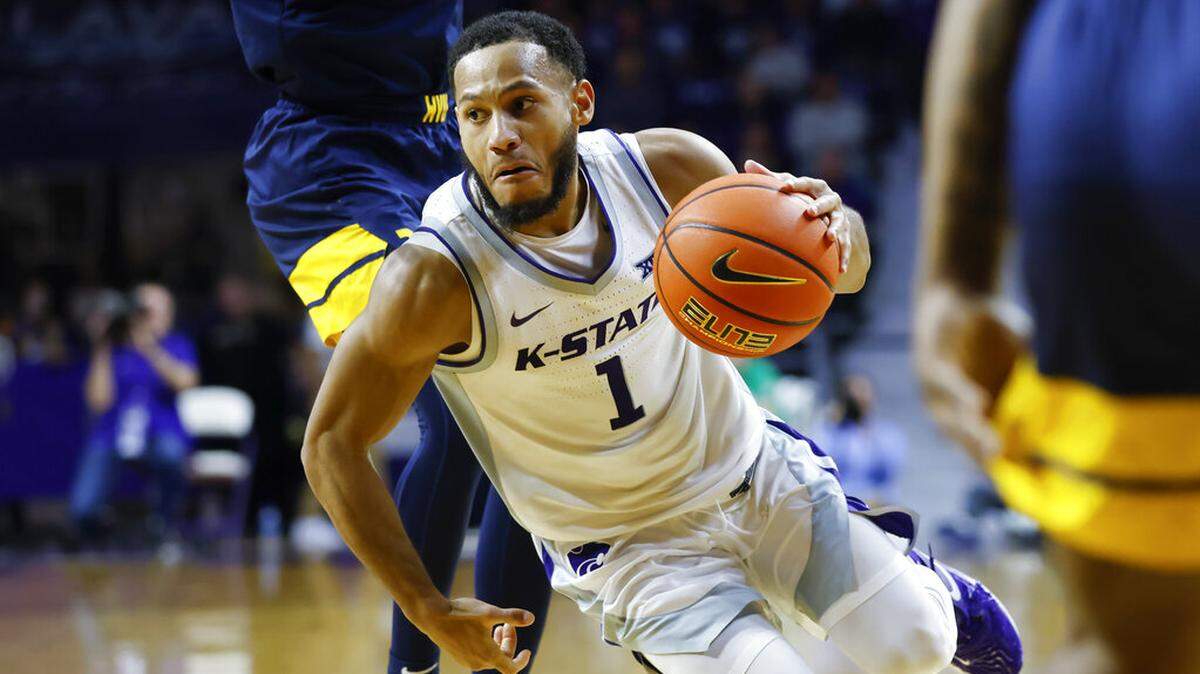 Kansas State guard Markquis Nowell drives to the basket during the second half of an NCAA college basketball game against West Virginia, Saturday, Dec. 31, 2022, in Manhattan, Kan.