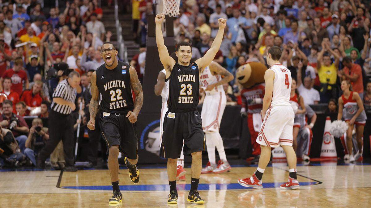 Wichita State Shockers guard Fred Van Vleet (23) and forward Carl Hall (22) celebrate as time expires in West Regional Final against Ohio State on Saturday at Staples Center in Los Angeles. The Shockers punched a ticket to the Final Four for the first time since 1965. (March 30, 2013)