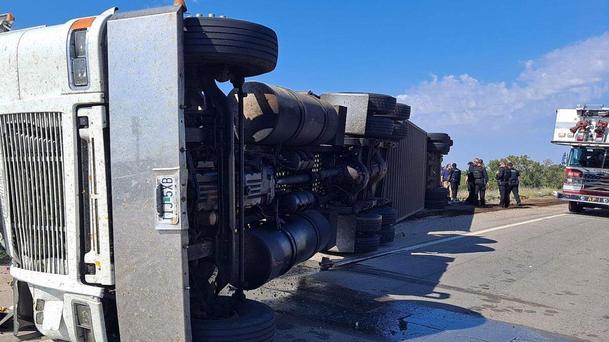 A semi driver pulling a trailer filled with cattle overturned Thursday on the Highway 50 westbound ramp to I-135 South, leaving the driver seriously injured and killing 25 cattle.