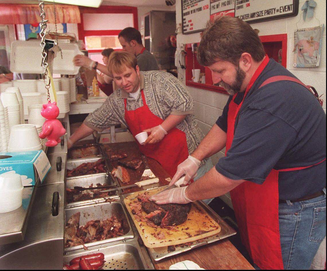 The late Ronald Cochran, right, and son Derek are pictured at the original Pig In Pig Out restaurant in 1998.