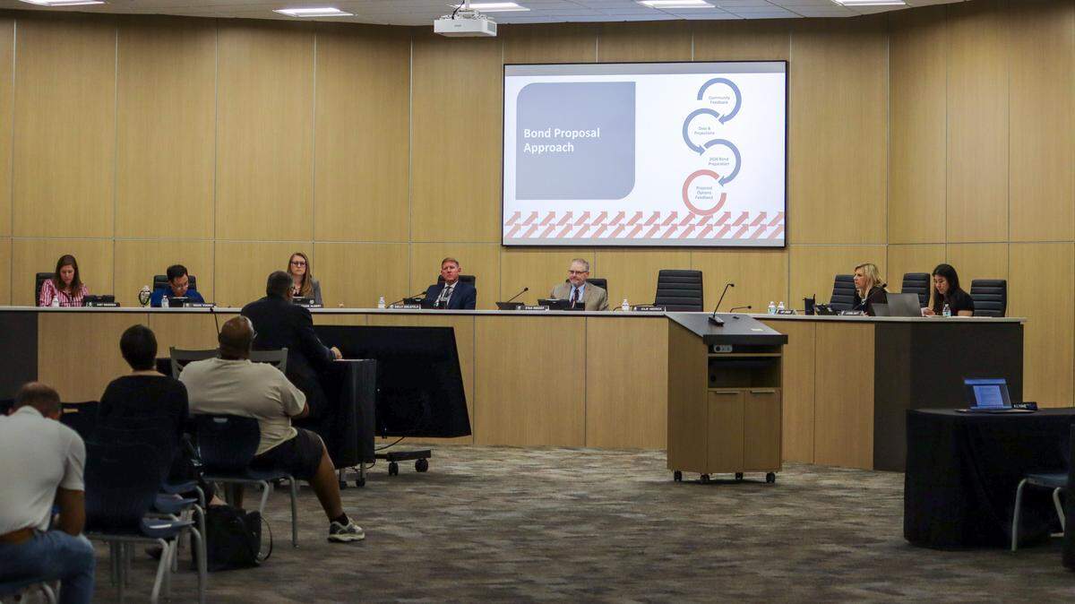 Members of the Wichita school board listen to a presentation by Deputy Superintendent Gil Alvarez on Monday night. Alvarez shared what the district learned from a series of community engagement sessions and recommended one of three bond proposals.