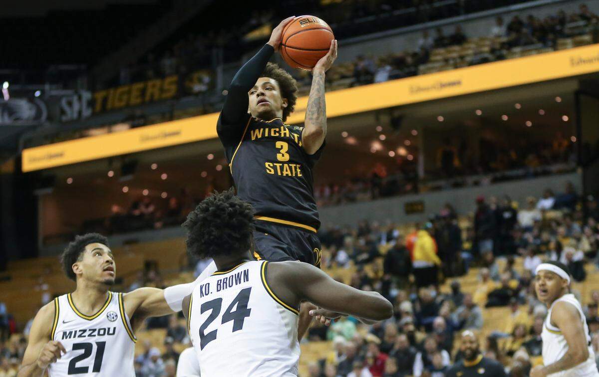 Wichita State’s Craig Porter IV looks for a pass while flying through the lane during the first half against Missouri on Friday night in Columbia.