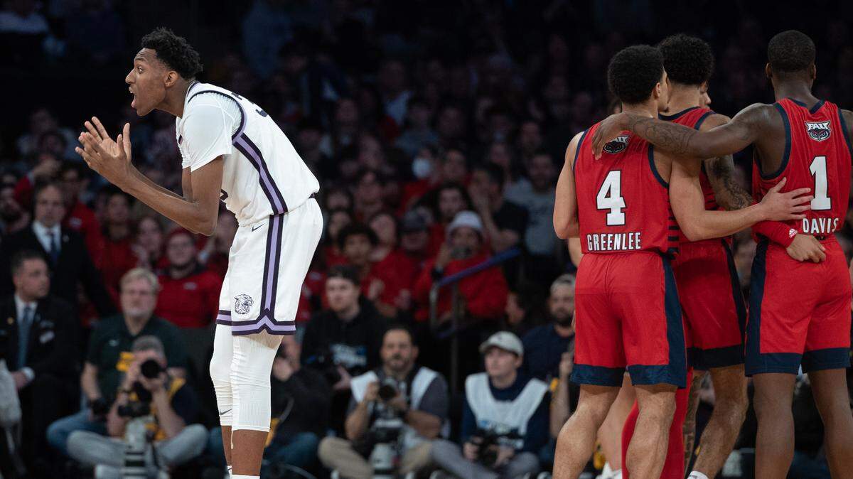 Kansas State’s Nae’Qwan Tomlin can’t believe a foul call against him on Florida Atlantic three point attempt during the second half of their east region final game at Madison Square Garden on Saturday night.