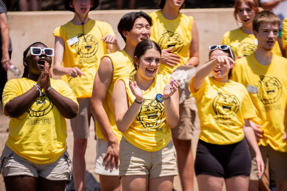 Prairie Schooner Mates cheer on their teammates, who are competing in the cowboy bathtub races on the Arkansas River on Saturday.