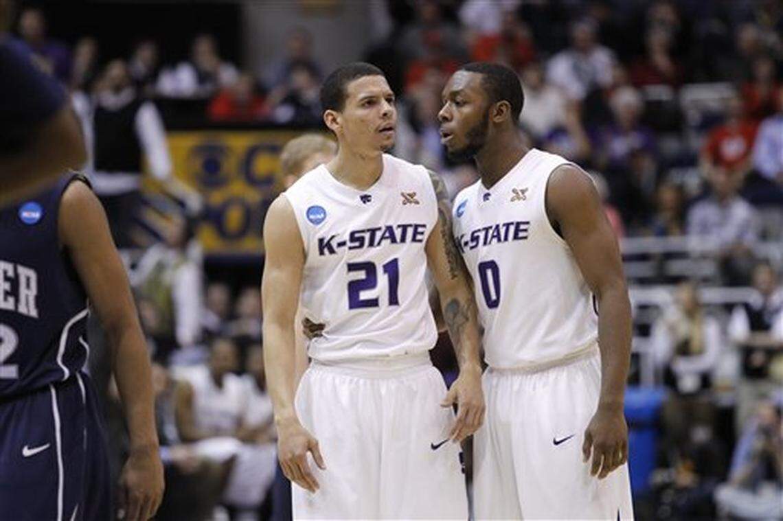 Denis Clemente, left, and Jacob Pullen react to play against Xavier in the second half of an NCAA West Regional semifinal college basketball game in Salt Lake City, Thursday March 25, 2010. (AP Photo/Paul Sakuma)