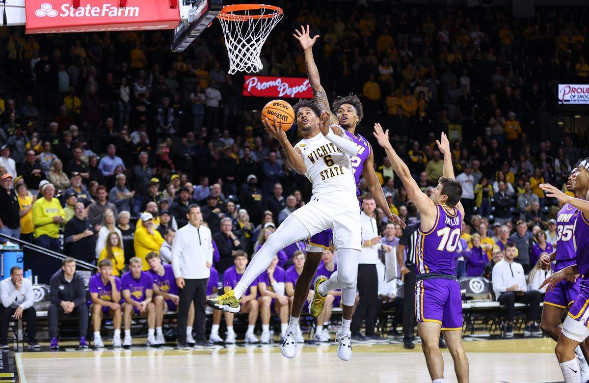 Wichita State forward Corey Washington finishes an acrobatic layup against Northern Iowa in a 79-73 victory by the Shockers at Koch Arena.