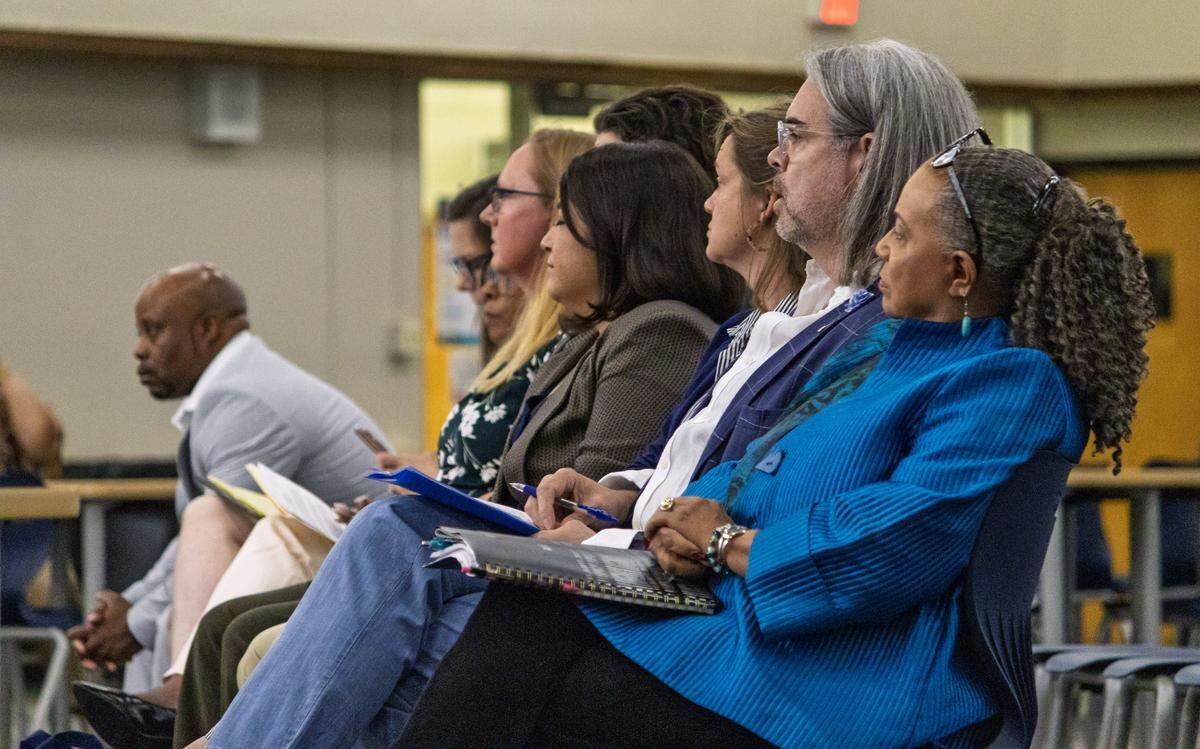 Applicants for the Wichita Public Schools at-large board member seat listen during public interviews held Friday ahead of the appointment for the vacant seat. Sheila Kinnard, right, was chosen to fill the position.