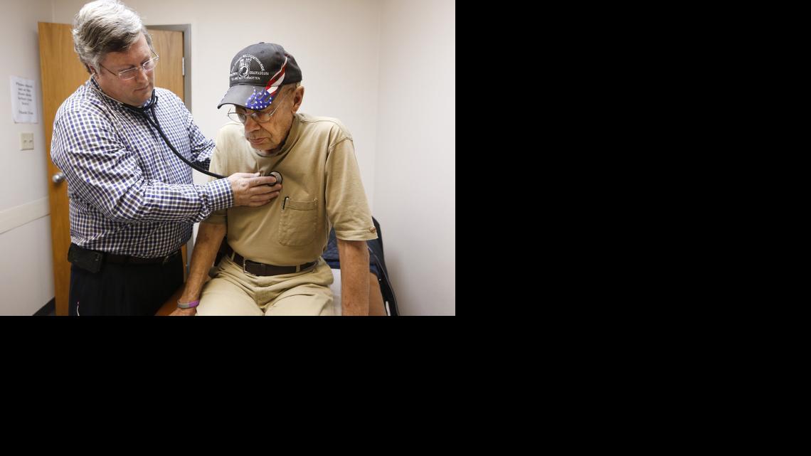 Family physician Paul Huser examines Dennis Young at West Wichita Family Physicians. (March 11, 2014) 

