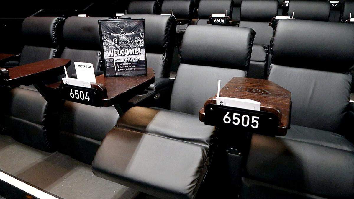 Moviegoers at Alamo Drafthouse theaters can order food and drinks from the menu as they sit in reclining chairs.