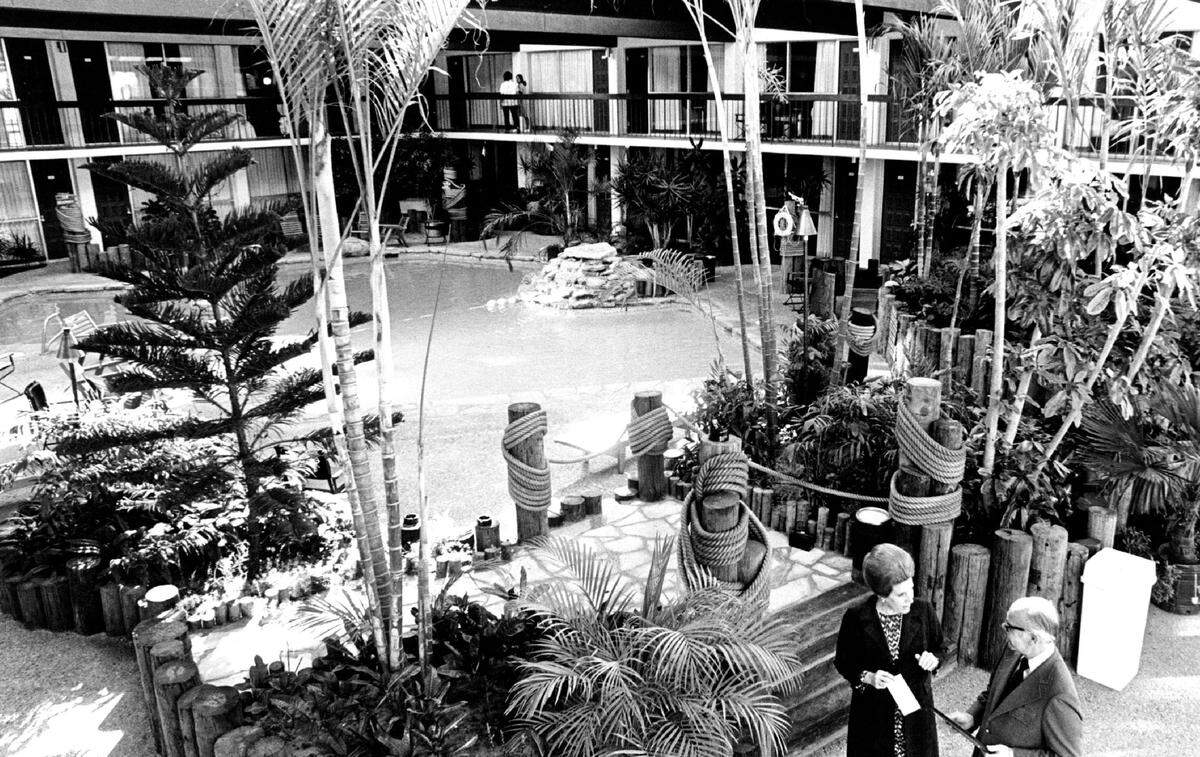A photo of the lavish pool on the ground floor of Holiday Inn East when it first opened in 1974. The hotel landscaped the indoor pool with plant life imported from Florida.