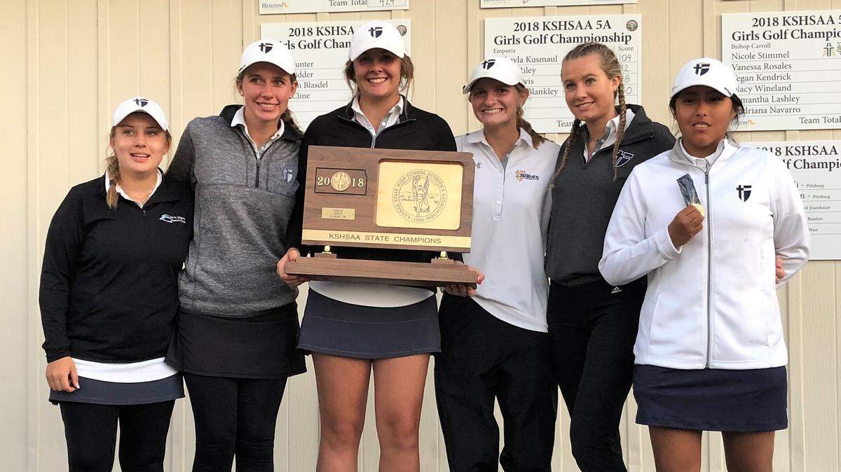 St. Thomas Aquinas poses with is second straight Kansas Class 5A girls golf state championship plaque after winning Tuesday at Hesston Golf Park.