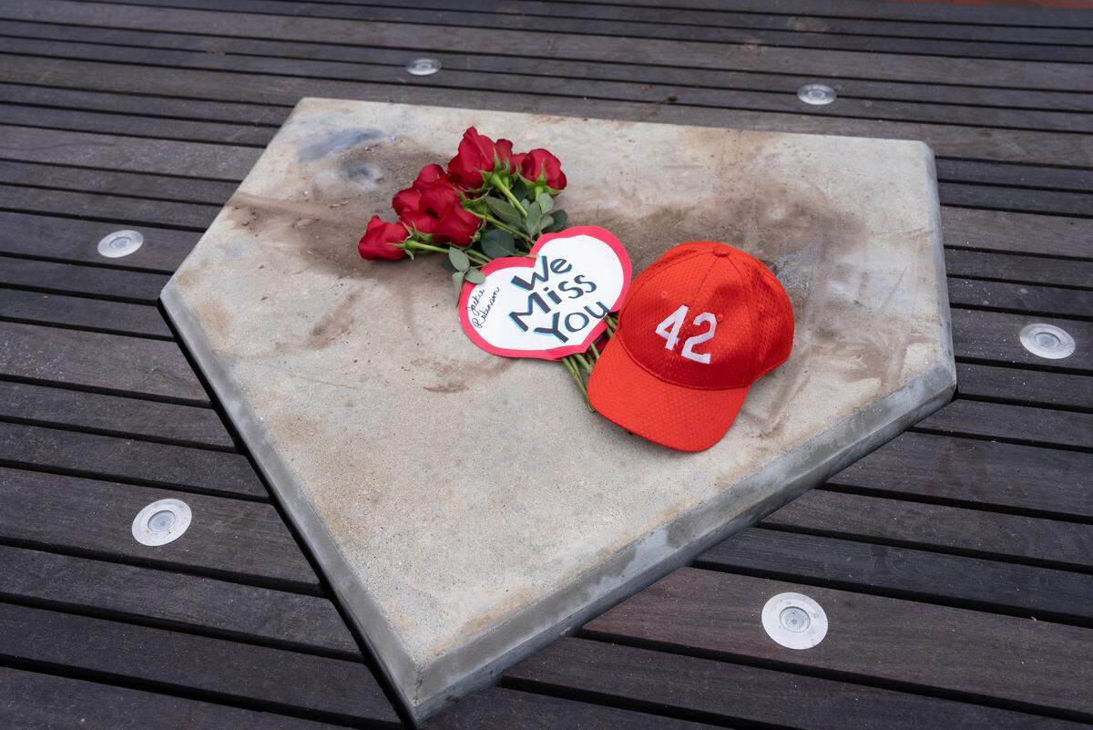 A group of 80 people gathered at the Jackie Robinson pavilion at McAdams Park on Saturday morning. A bronze statue of Jackie Robinson was cut down and stolen from this spot on Thursday morning. The statue is valued at $75,000.