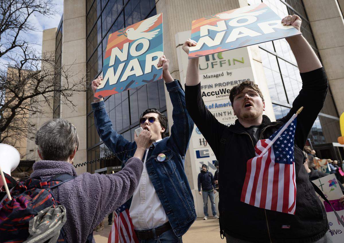 Protestors speak out against the war in Iran during the “No Kings” protest in downtown Wichita on Saturday.