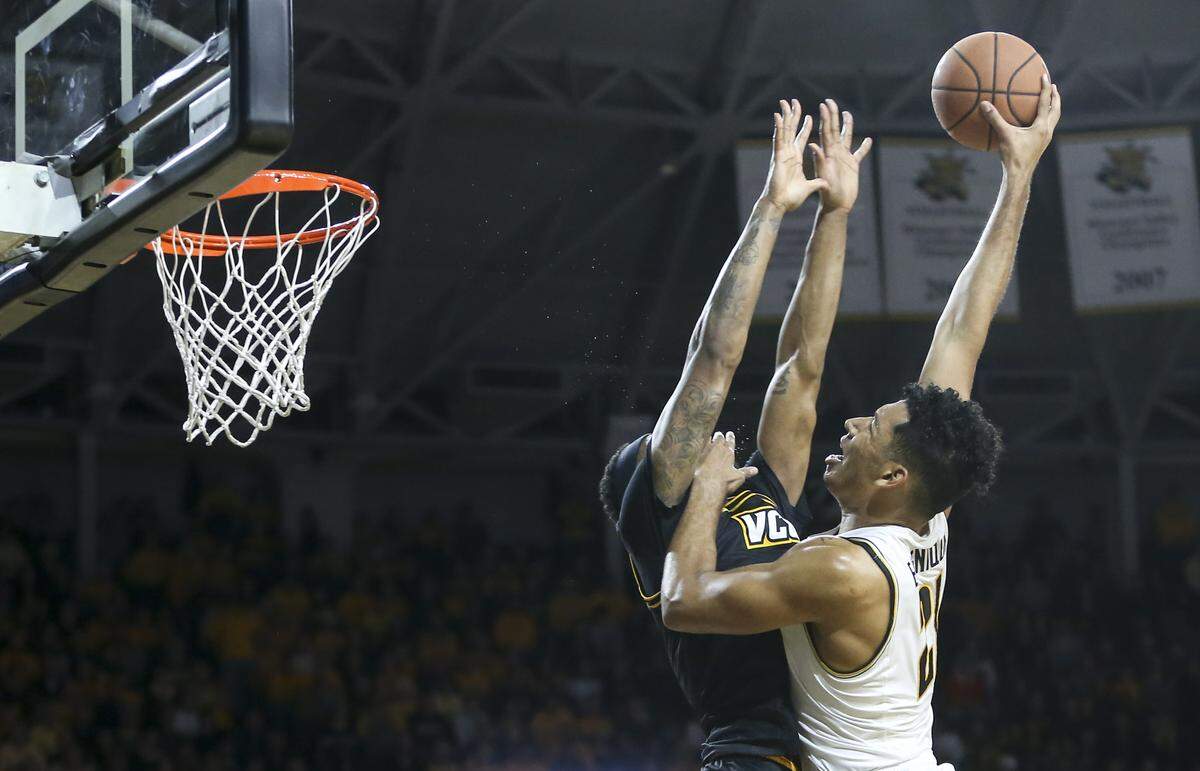 Wichita State’s Jaime Echenique shoots over VCU forward Corey Douglas during the first half of their game at Koch Arena on Saturday.