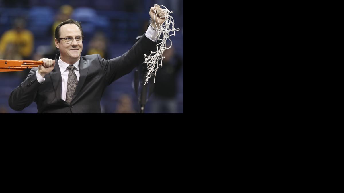 Wichita State coach Gregg Marshall cuts down the net after winning the championship game at the Missouri Valley Conference Tournament in St. Louis. (March 9, 2014)

