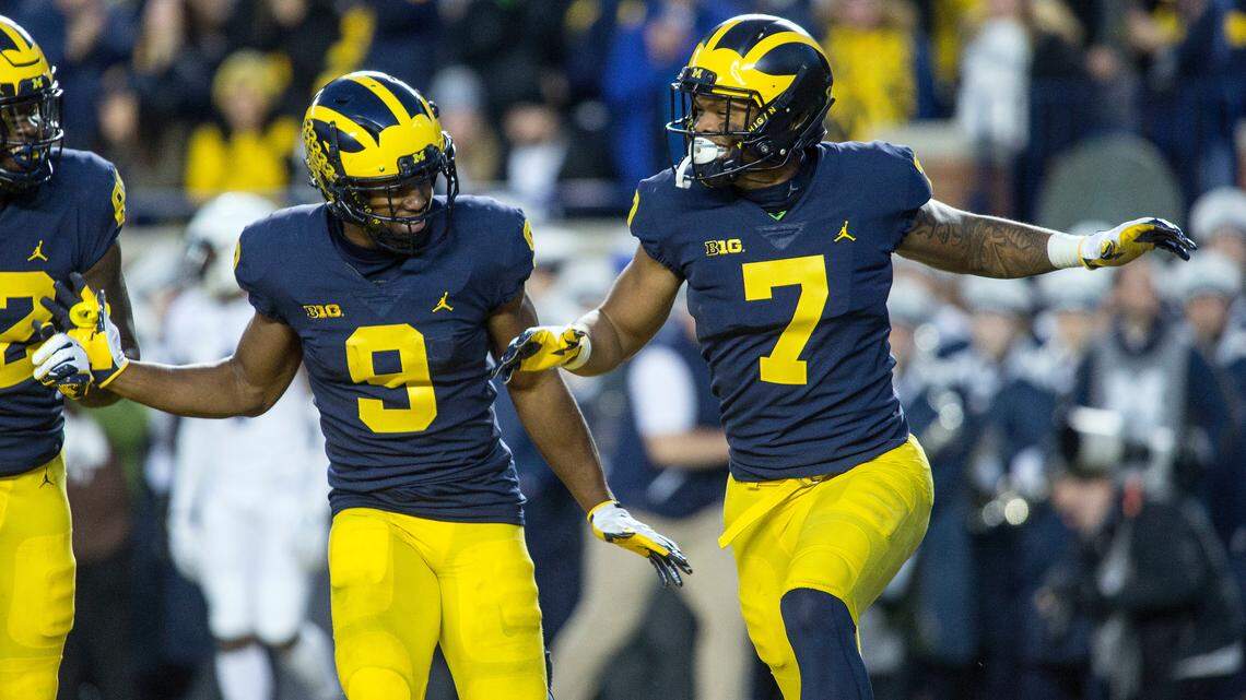Michigan wide receiver Donovan Peoples-Jones (9) celebrates with wide receiver Tarik Black (7) in the fourth quarter of an NCAA college football game Penn State in Ann Arbor, Mich., Saturday, Nov. 3, 2018. Michigan won 42-7. (AP Photo/Tony Ding)