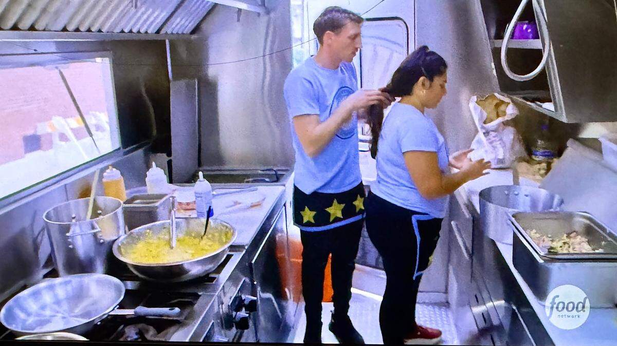 Wichita’s Chad Freeman comforts his wife and food truck teammate Carolina Brandan on Sunday night’s episode of “The Great Food Truck Race’ on Food Network.