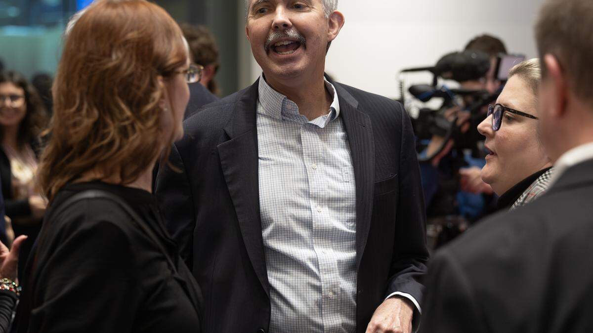 Wichita City Manager Robert Layton is greeted by visitors during a reception for him at the Wichita Art Museum earlier in December.