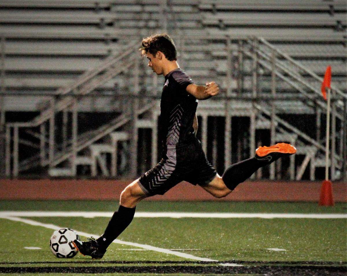 Campus senior defender Daine Crum sends in a free kick during the Colts 4-0 win over Wichita North on Tuesday. (Oct. 23, 2018)