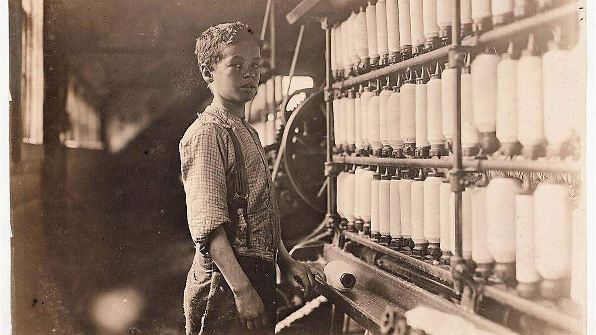 John Dempsey, said to be 12 years old, working in a Rhode Island textile mill in 1909.
