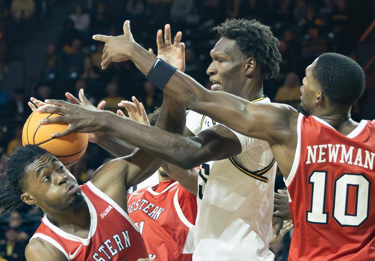 Wichita State’s Quincy Ballard fights for a rebound during the second half of their game against Western Kentucky at Koch Arena on Thursday night.