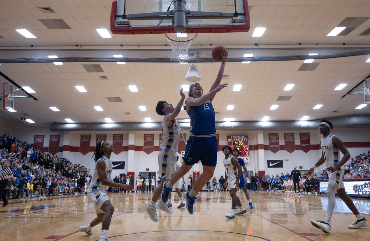Kapaun’s Blaise Dalian makes a layup in the fourth quarter against Collegiate on Monday night at Friends University.