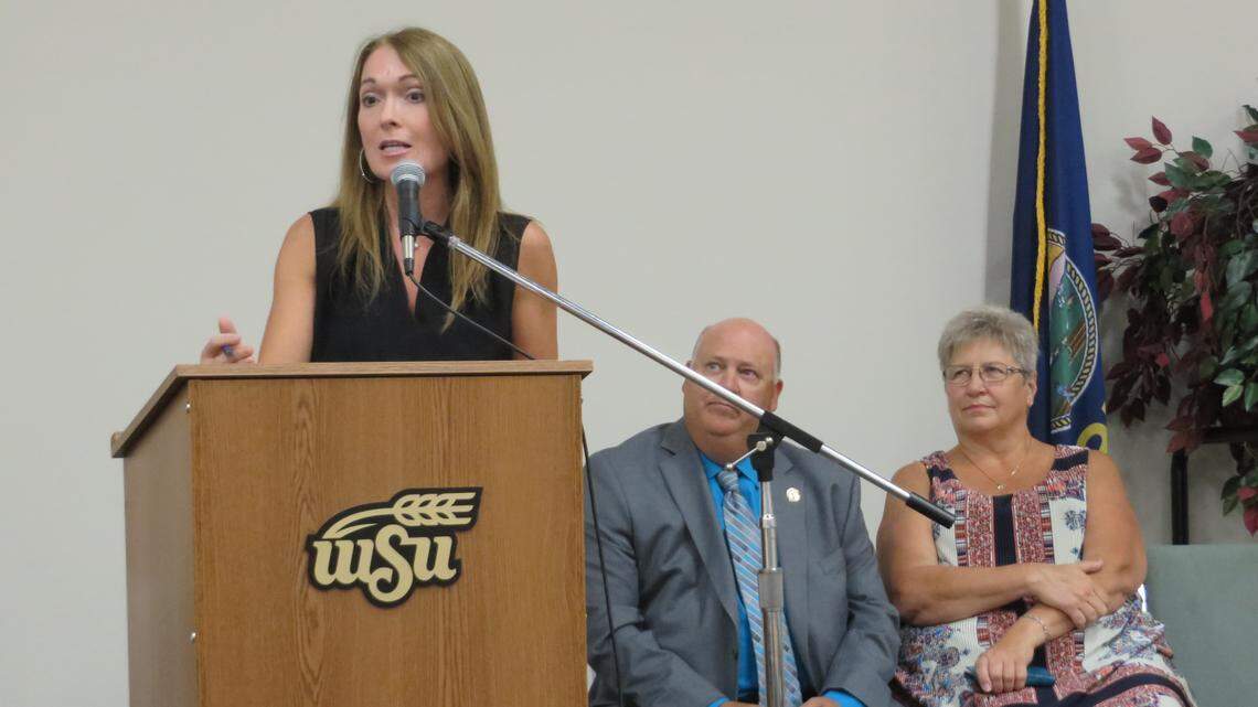 Rep. Kristey Williams (standing) and Reps. Steve Crum and Brenda Landwehr spoke at a rally last month opposing Westar increasing charges on solar-power customers. The rally preceded a Kansas Corporation Commission public hearing where roughly 100 people showed up to protest electric rate increases.