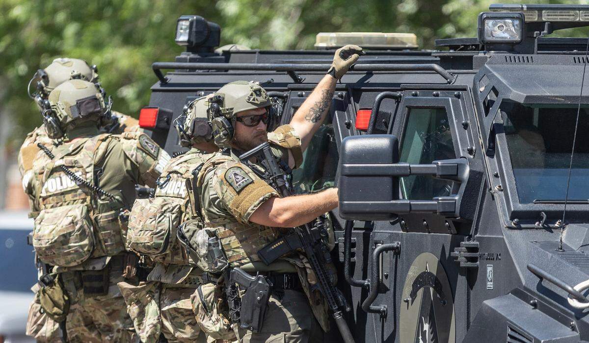 Members of the WPD SWAT team arrive at Douglas and St. Francis during a standoff with a suspect in an apartment building in the 600 block of east Douglas.