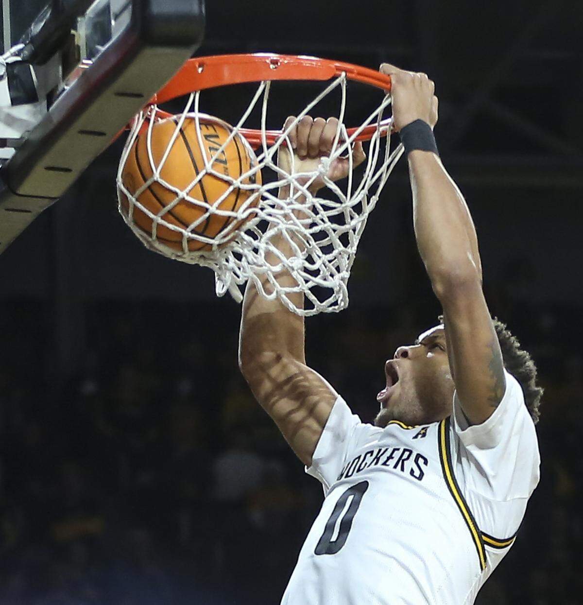 Wichita StateÕs Dexter Dennis dunks the ball during the first half of their game against Prairie View A&M on Wednesday night at Koch Arena.