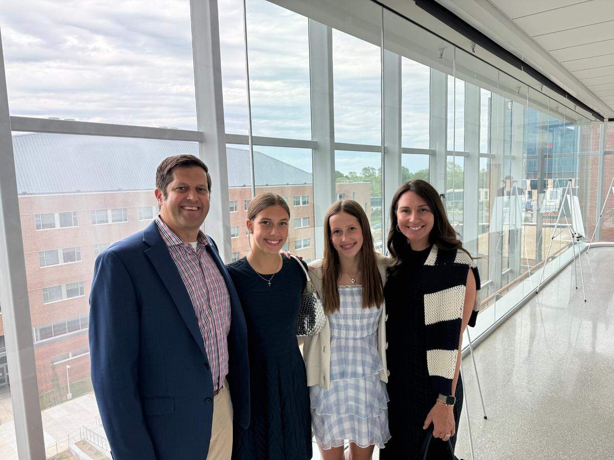 Jon and Lauren Rolph, on the far left and far right, with their daughters, Emma, left, and Olivia, at the groundbreaking for the new University of Kansas Cancer Center.