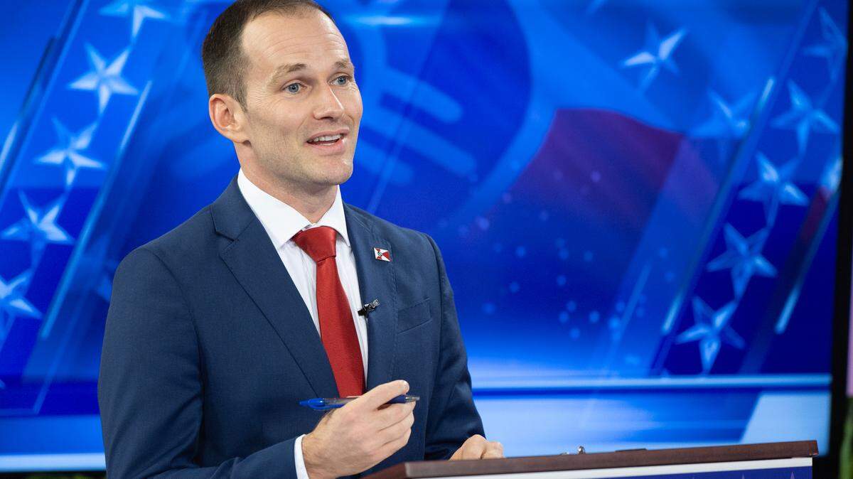 Brandon Whipple during a mayoral debate with Lily Wu in 2023. 