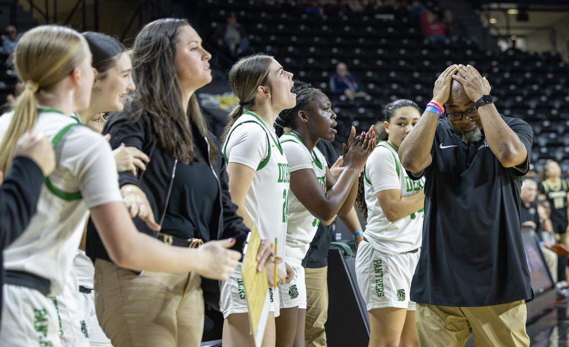 Derby head coach Bryan Chadwick can barely stand to watch as his team forced a turnover and drew a foul in the closing seconds against Topeka High on Tuesday at the quarterfinals of the 6A basketball tournament at Koch Arena. Derby went on to win when Topeka missed their final shot attempt to tie the game.