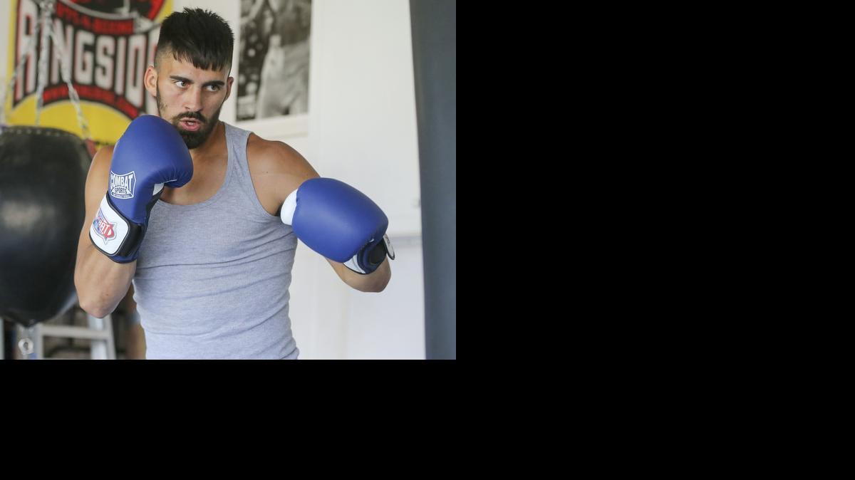 Jeff Page Jr. works out in his garage in Andover on Tuesday. He fights fellow Kansan Dominique Alexander on Saturday night at Beech Activity Center.

