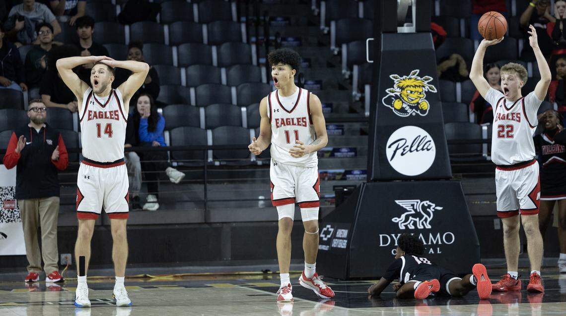 Maize players, from left: Charlie Oakman, Karson Miles and Cooper Shaw react to a foul call on Wichita Heights’ Jalihn Timmons with under 10 seconds to go in the quarter final game at Koch Arena on Wednesday. Timmons hit both free throws to give Heights a one point lead and eventually, the victory.