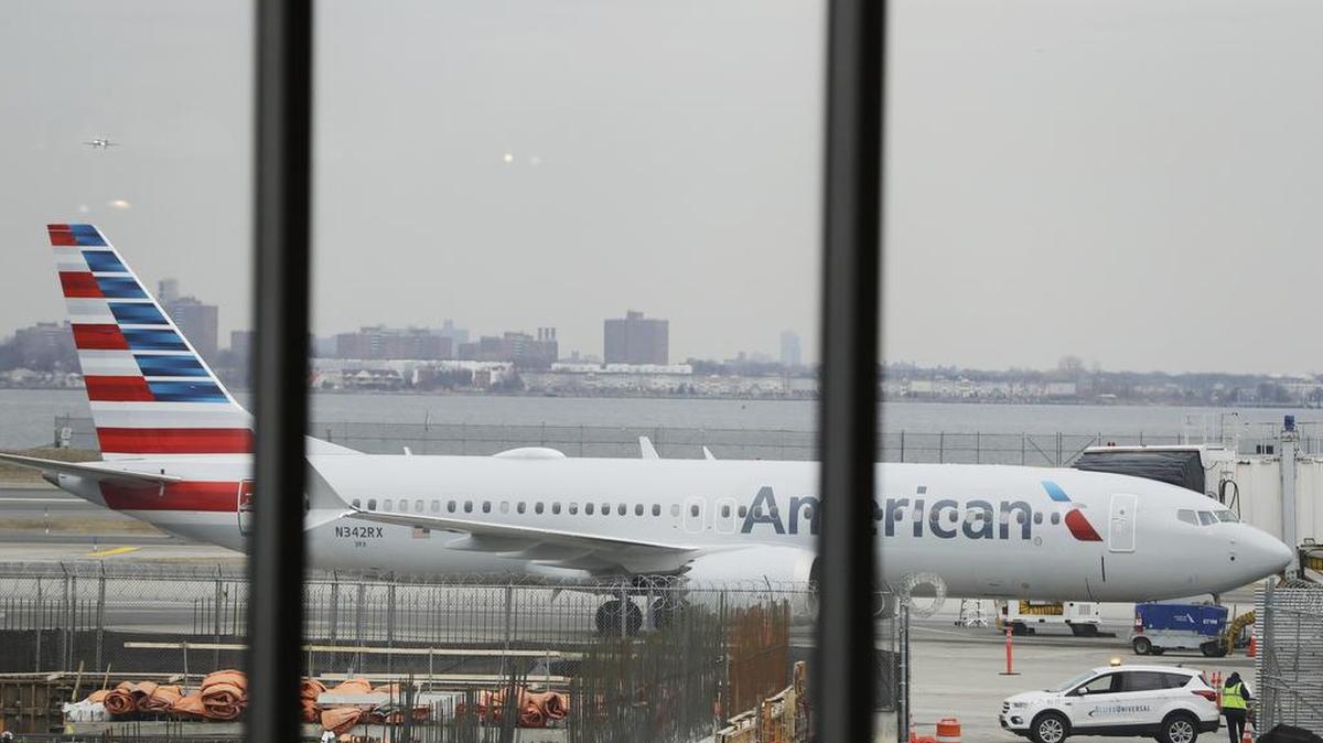 An American Airlines Boeing 737 MAX 8 plane sits at a boarding gate at LaGuardia Airport Wednesday, March 13, 2019, in New York. The Federal Aviation Administration issued an emergency order Wednesday grounding all Boeing 737 Max aircraft in the wake of a crash of an Ethiopian airliner that killed 157 people.