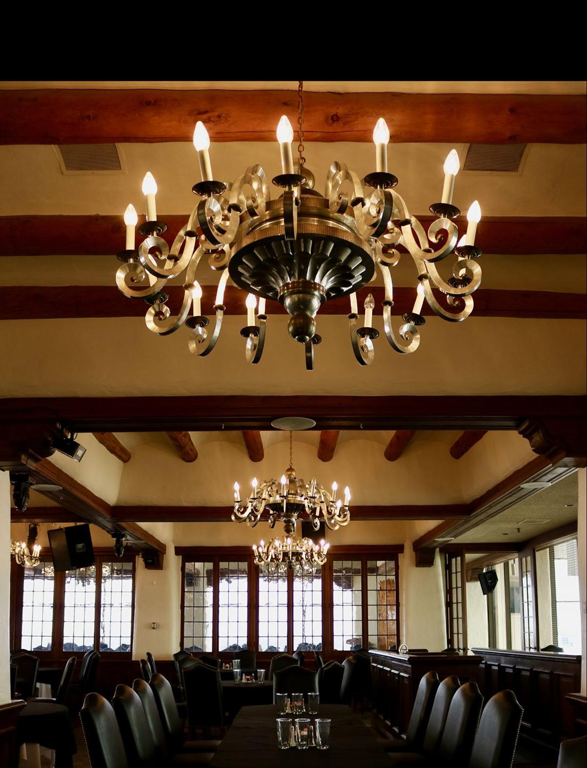 The 16 candelabra chandeliers original to the Petroleum Club space at Douglas and Broadway were removed to make way for more modern fixtures.