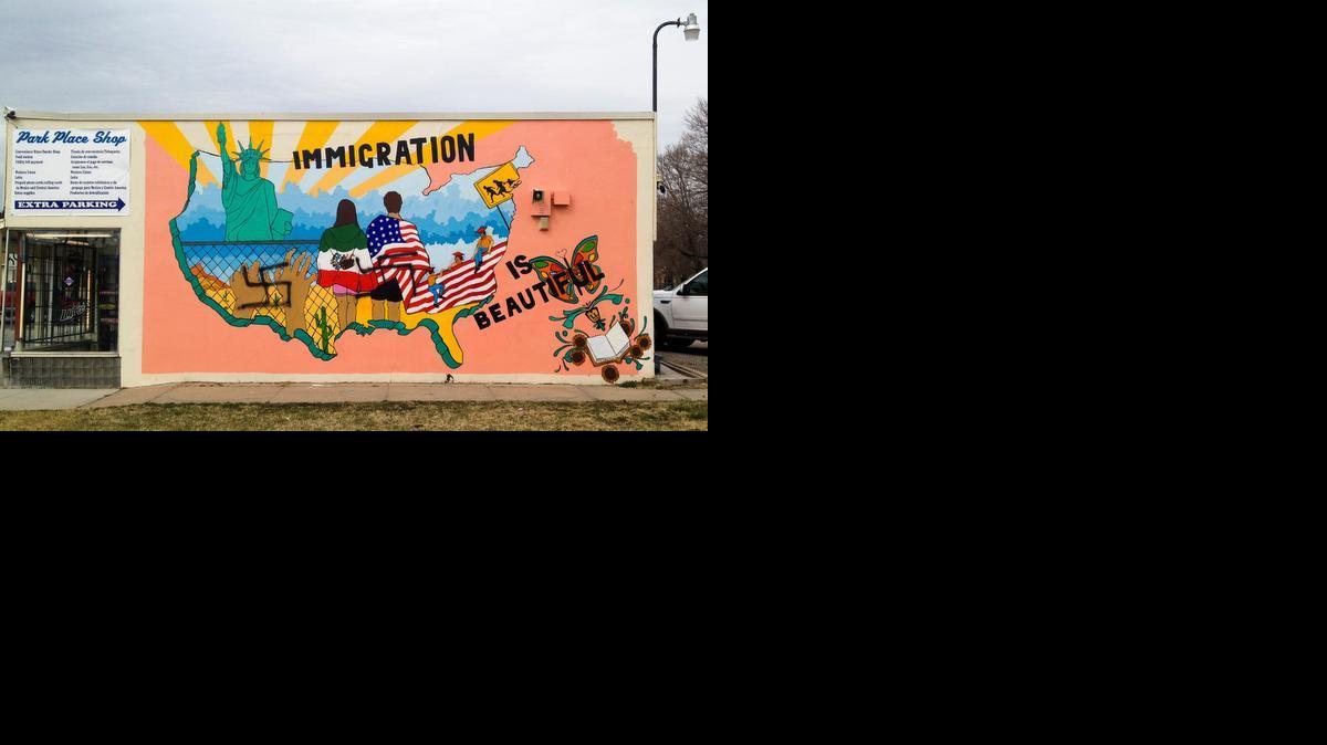 An immigration mural on the side of a building at 21st and Park Place has been vandalized once again. Two swastikas have been spray-painted onto the mural. 

