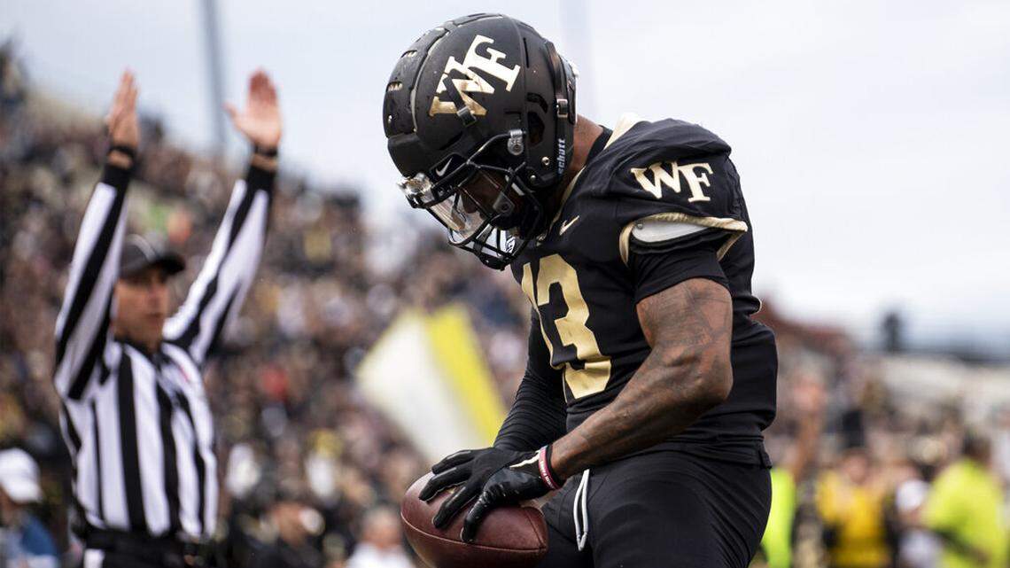 Wake Forest wide receiver Ke’Shawn Williams (13) celebrates a touchdown during the first half of an NCAA college football game against Duke on Saturday, Oct. 30, 2021, in Winston-Salem, N.C. (AP Photo/Matt Kelley)
