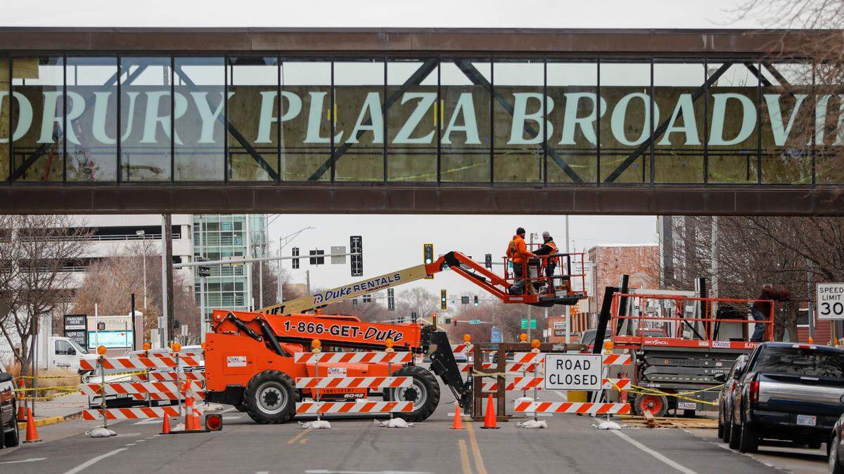 Repair work continues on a skywalk that connects the Drury Plaza Broadview Hotel with a parking garage. The work has a block of Waco closed down. The street will reopen Friday.