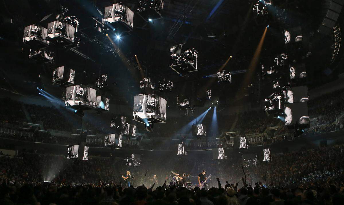 Members of the band Metallica play for a record crowd of 15,690 at Intrust Bank Arena on Monday night.