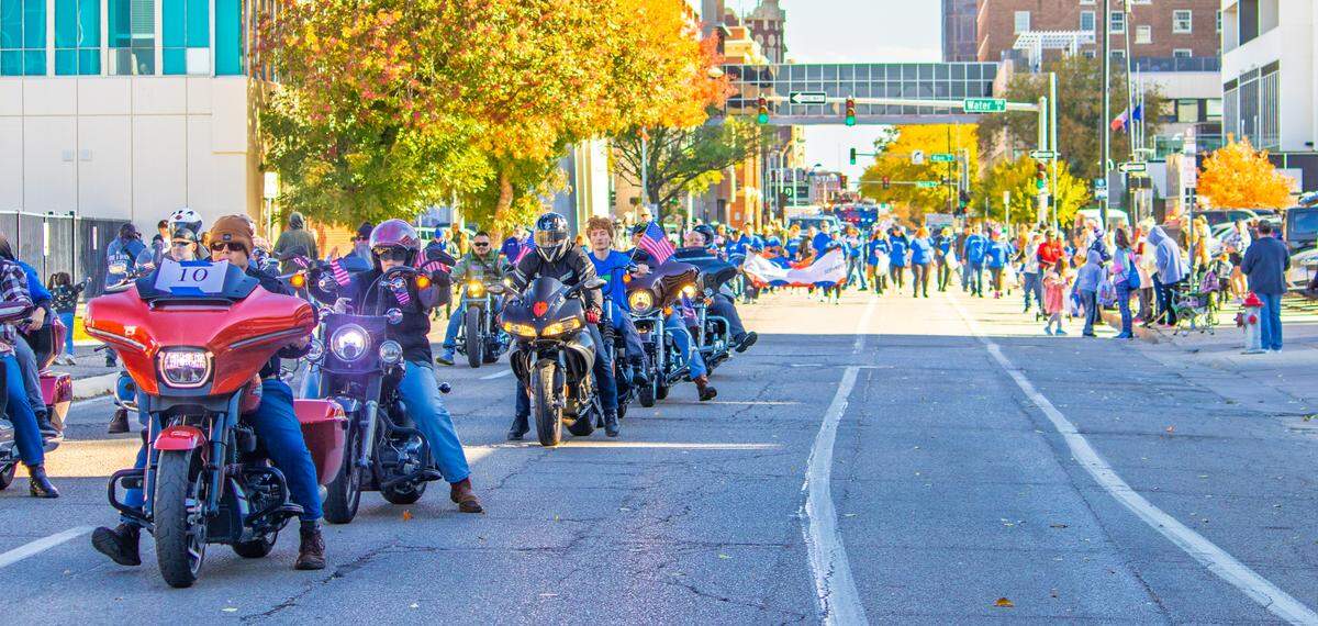 Motorcyclists and parade walkers proceed down First Street during Wichita’s 2025 Veterans Day parade on Saturday, Nov. 8.  After the parade, a celebration was held at Exploration Place.