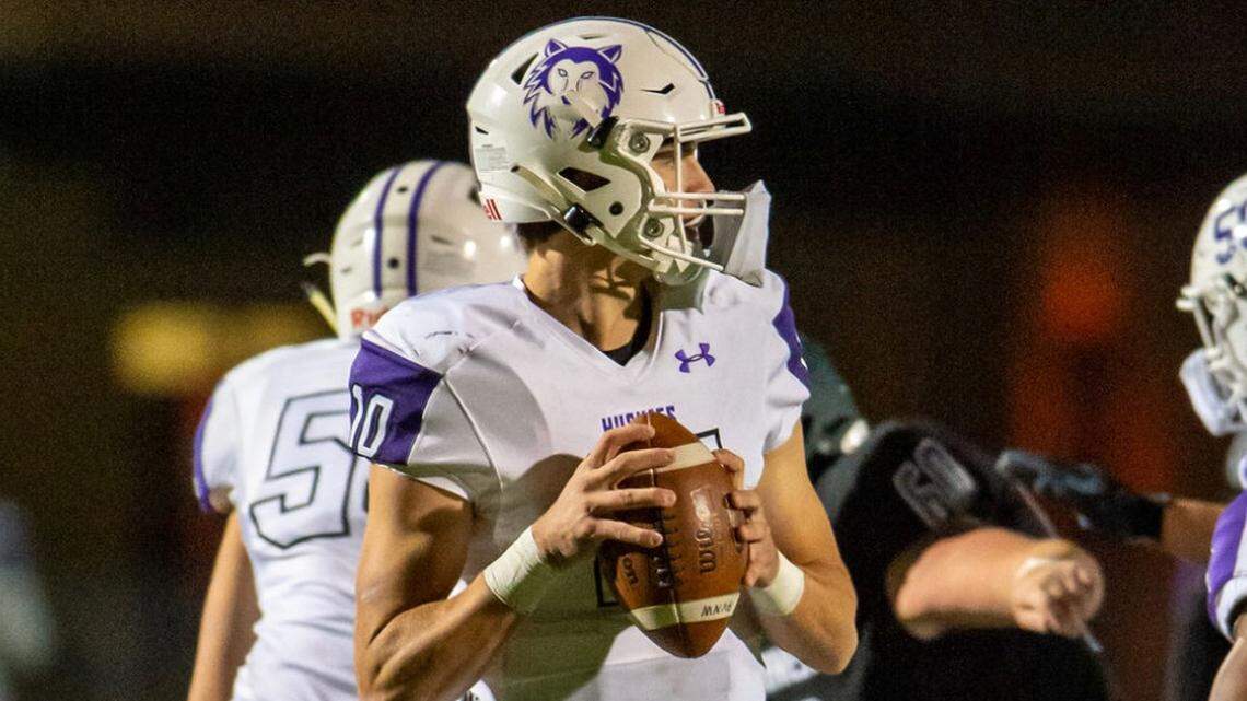 Blue Valley Northwest quarterback Mikey Pauley gets ready to throw a pass during a high school football game.
