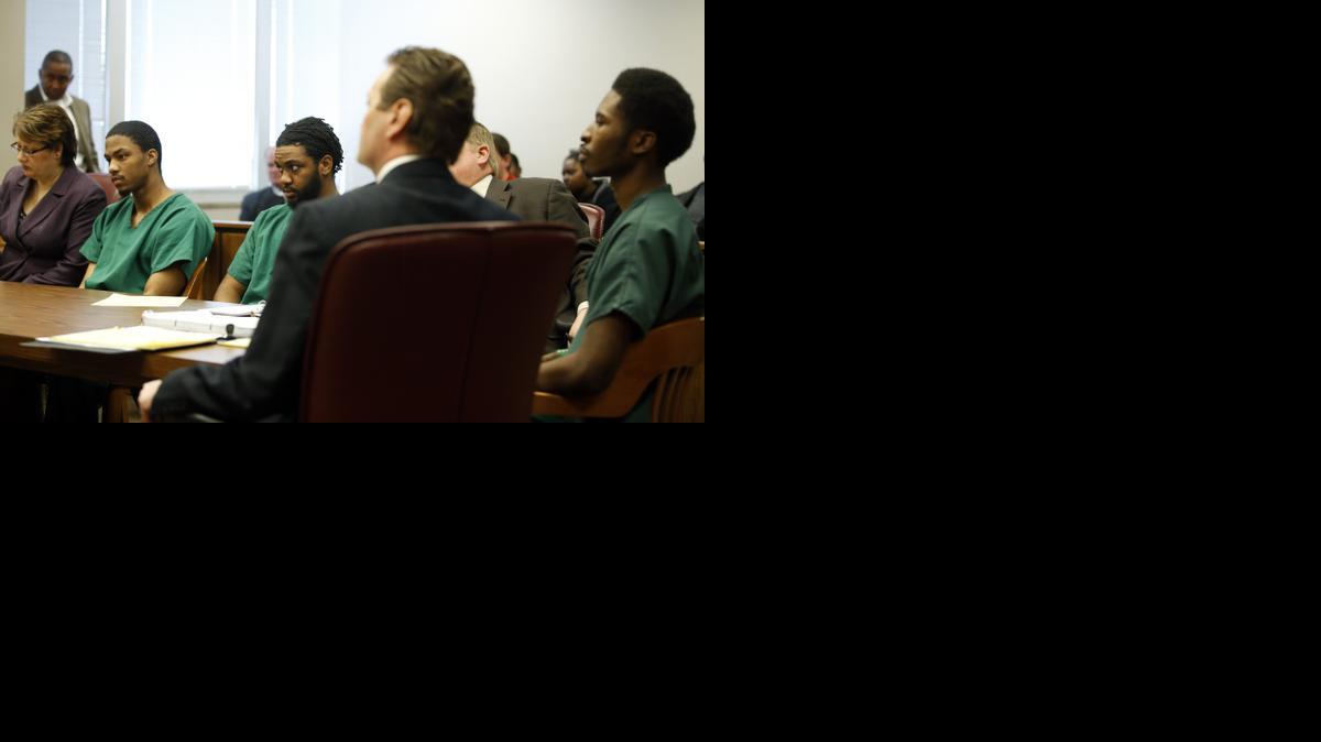 Three suspects in the theft of a diamond ring on Dec. 29, 2013, from a dying woman listen to the testimony of her husband, Kris Zimmerman, during a preliminary hearing in Sedgwick County District Court on Thursday. Left to right, Keith Hickles, Quanique Thomas-Hameen and Daquantrius Johnson. (Feb. 13, 2014)

