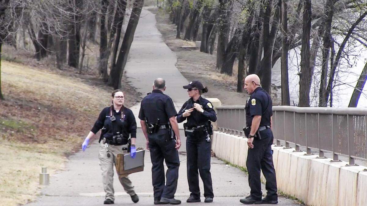 Wichita police investigate where a man tried to sexually assault an 18-year-old woman who was jogging along the river near Seneca and McLean on Monday afternoon. The man was arrested after a city worker across the river called 911. (March 26, 2018)