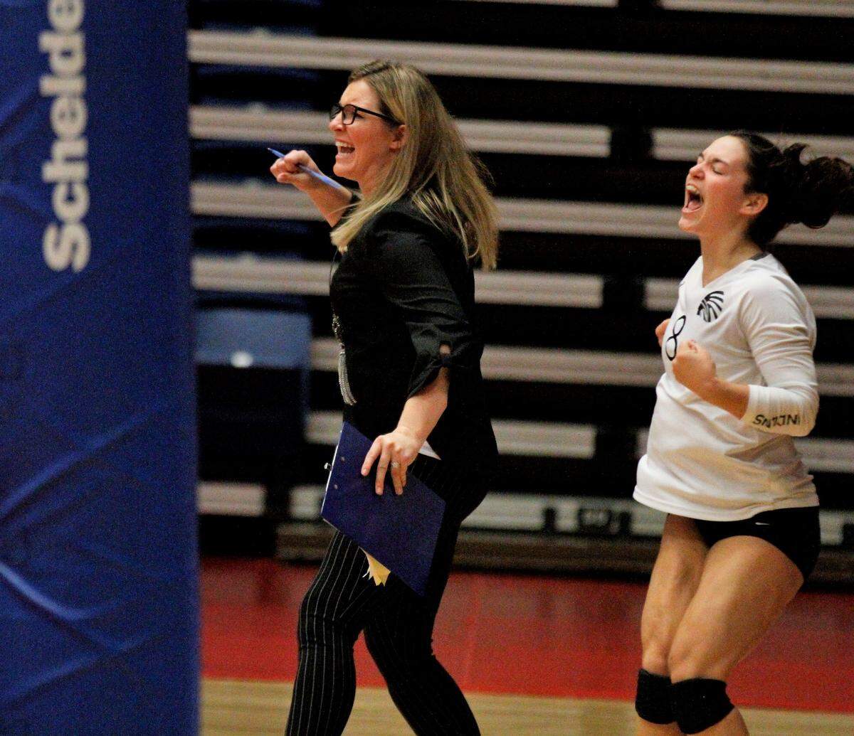 Andale volleyball coach Kaylie Bergkamp and junior Madison Grimes celebrate a point during the Class 4A state tournament. (Oct. 26, 2018)
