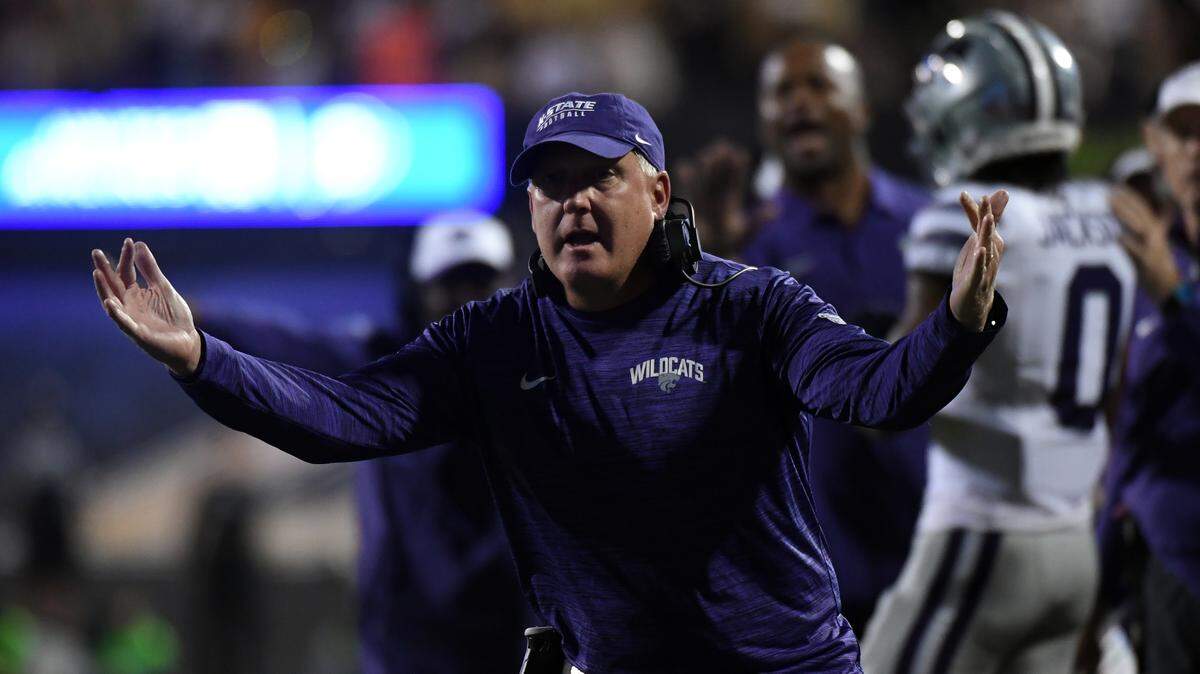 Kansas State Wildcats head coach Chris Klieman celebrates after a touchdown during the first half against the Colorado Buffaloes at Folsom Field.
